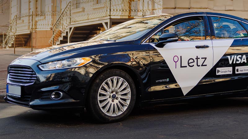 Letx taxi car with Letz and Visa logos