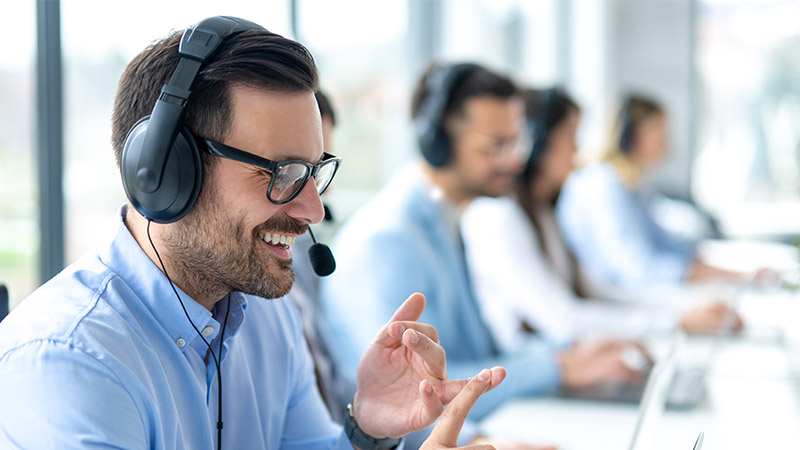 A support manager with a headset on his head